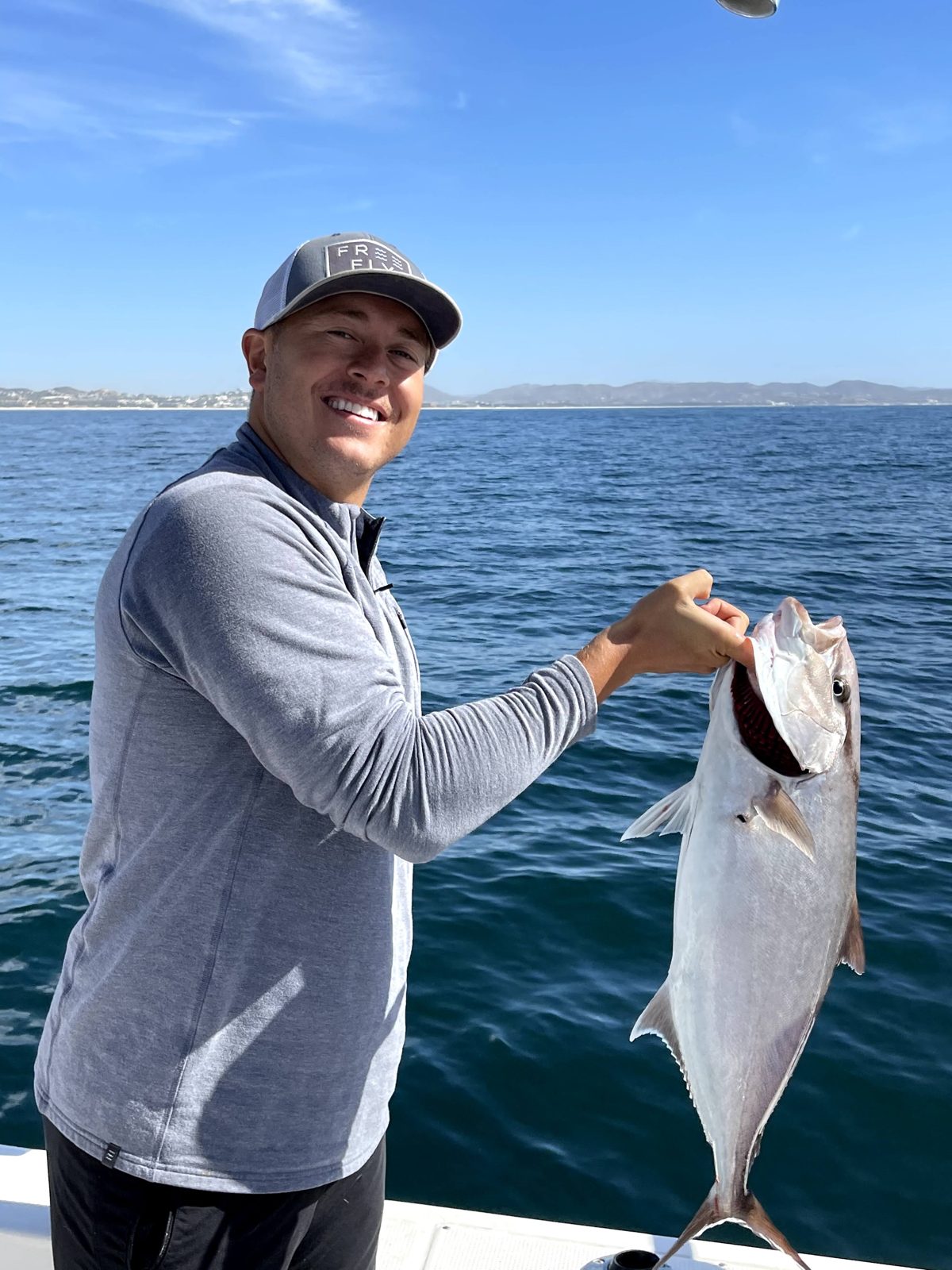 Andy fishing off a boat